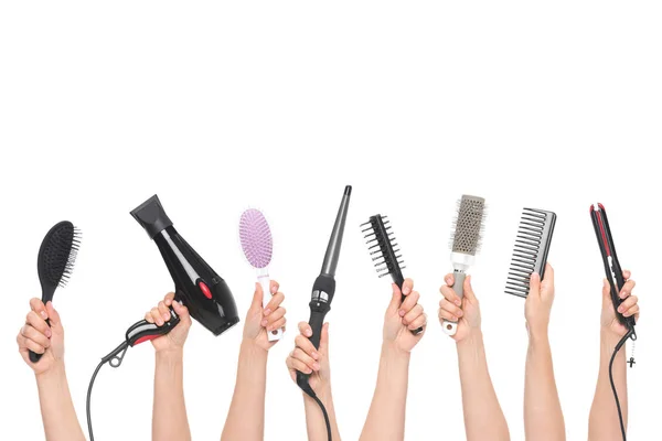 Hands holding hairdressing tools — Stock Photo