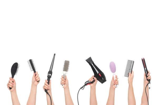 Hands holding hairdressing tools — Stock Photo