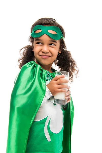 Superhero girl with glass of milk — Stock Photo