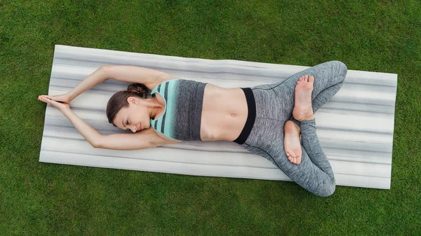 Woman performing lotus pose — Stock Photo