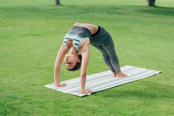 Caucasian woman performing yoga — Stock Photo