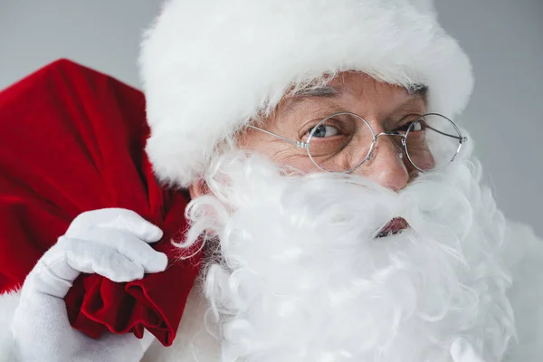 Santa claus holding bag — Stock Photo