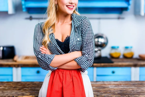 Housewife with crossed arms — Stock Photo