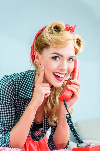 Pin up girl talking on telephone — Stock Photo