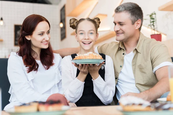 Beautiful family in cafe — Stock Photo