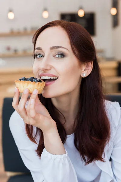 Woman eating delicious dessert — Stock Photo