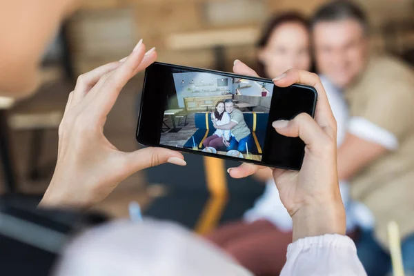 Taking photo of mature couple — Stock Photo