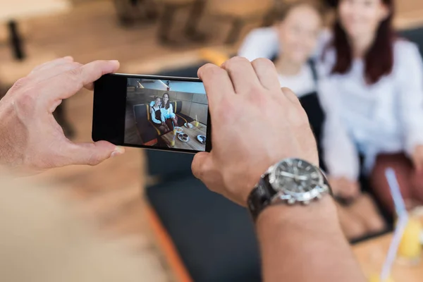 Taking photo of mother and daughter — Stock Photo