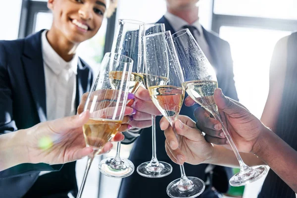 Colleagues drinking champagne in office — Stock Photo