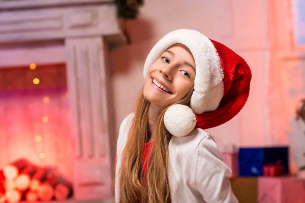 Teen girl in santa hat — Stock Photo