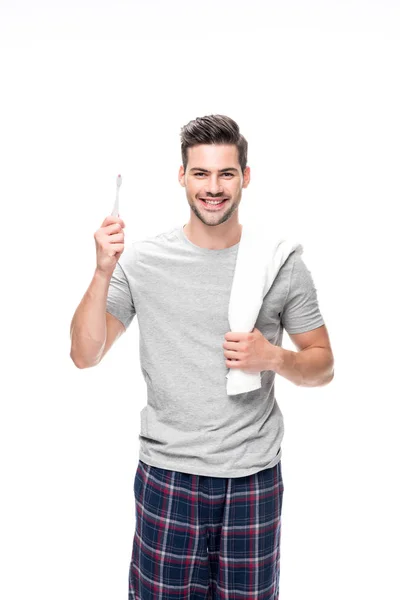 Homme avec brosse à dents et serviette — Photo de stock