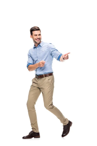 Man walking and pointing at side — Stock Photo