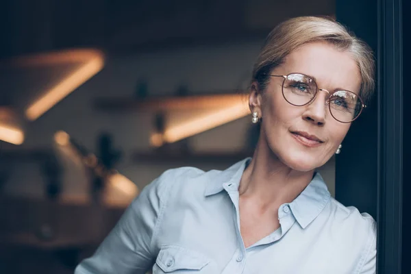 Pensive woman in eyeglasses — Stock Photo