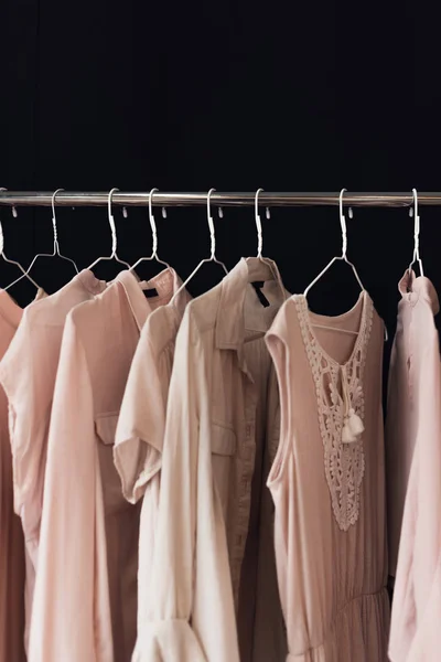 Clothing hanging on clothes rack — Stock Photo