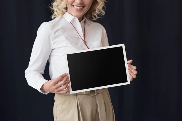 Woman with blank blackboard — Stock Photo