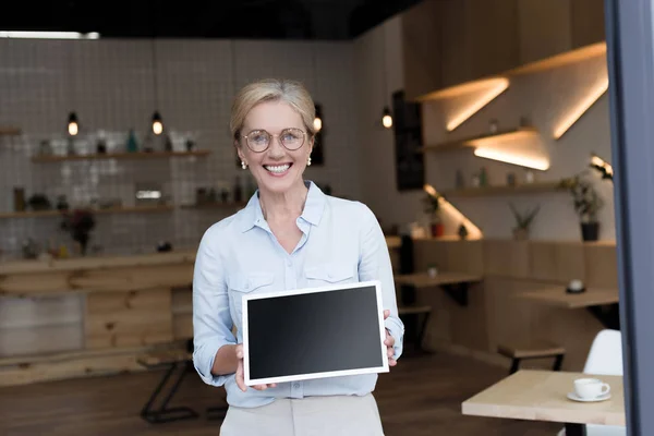 Shop owner with blackboard — Stock Photo