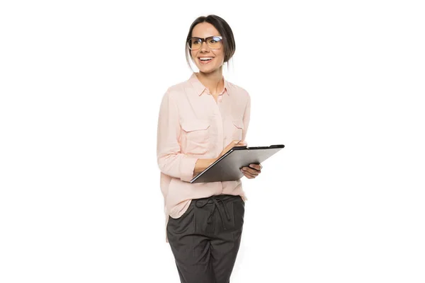 Young businesswoman with clipboard — Stock Photo