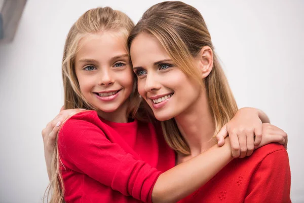 Hugging mom and daughter — Stock Photo