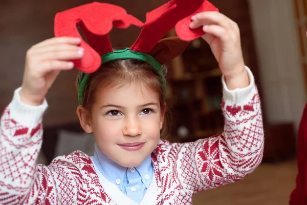 Child in antlers headband — Stock Photo