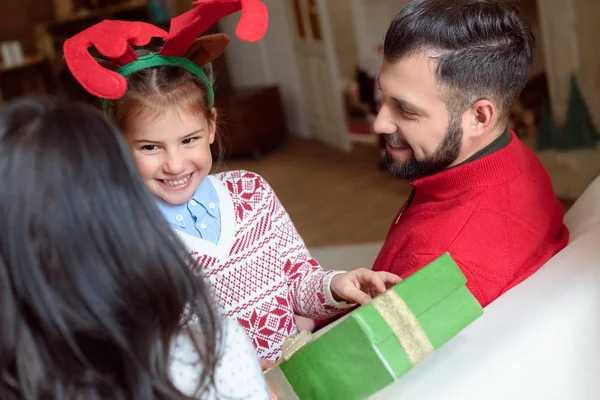 Family with christmas present — Stock Photo