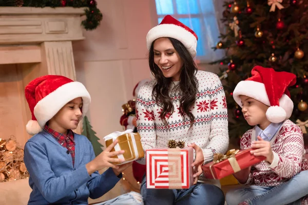 Happy family with christmas gifts — Stock Photo