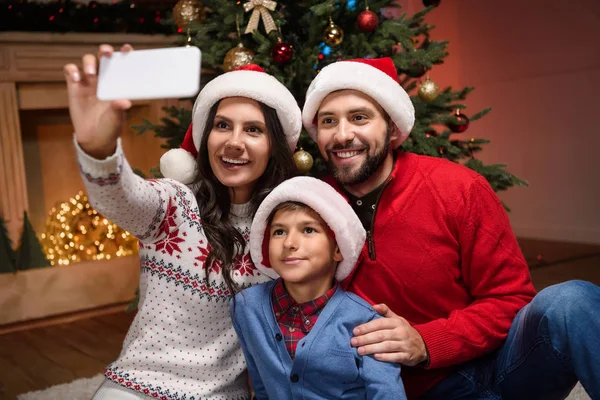 Family taking selfie at christmas — Stock Photo