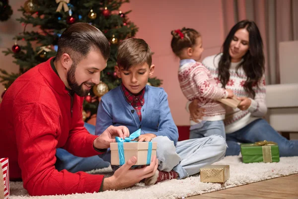 Family with christmas presents — Stock Photo