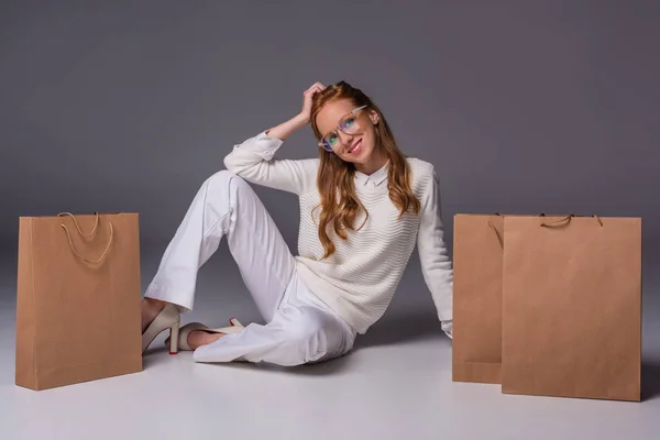 Fashionable girl with shopping bags — Stock Photo
