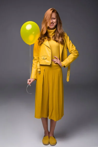 Fashionable girl in yellow clothes — Stock Photo