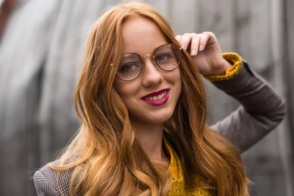 Redhead girl in eyeglasses — Stock Photo