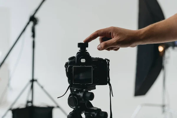 Digital photo camera on tripod — Stock Photo