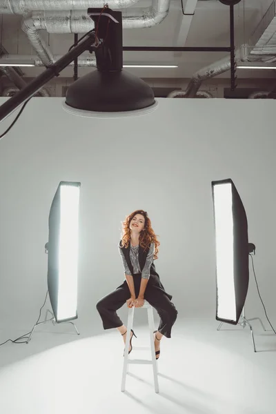 Cheerful model in photo studio — Stock Photo