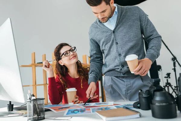 Photographers looking on photos — Stock Photo