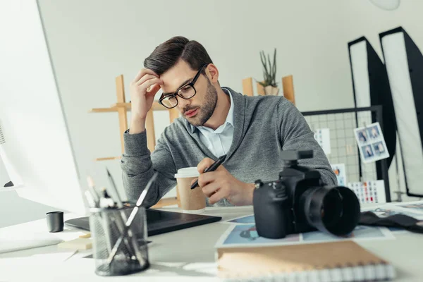 Photographer working with graphics tablet — Stock Photo