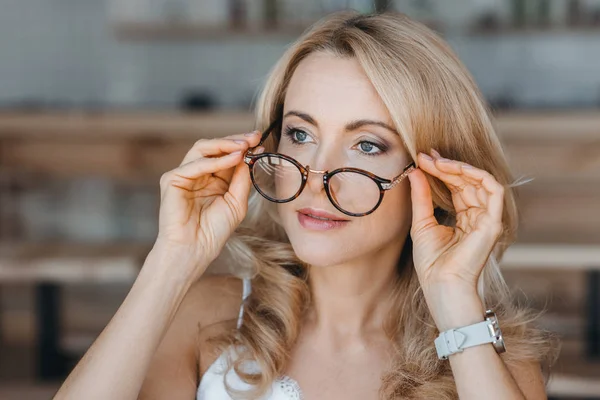 Beautiful middle aged woman with eyeglasses — Stock Photo