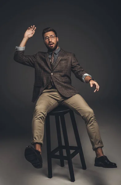 Man falling from bar stool — Stock Photo