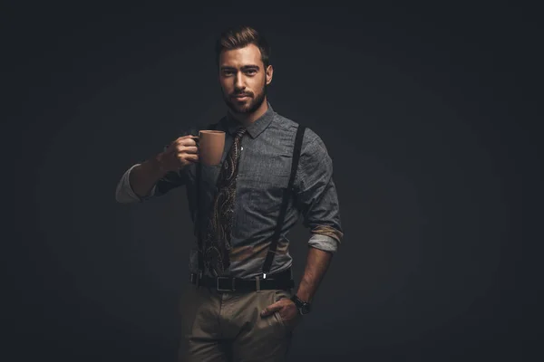 Handsome man holding cup — Stock Photo