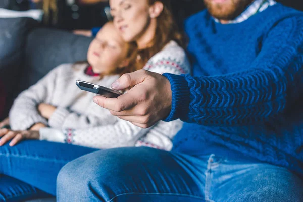 Family relaxing on couch — Stock Photo