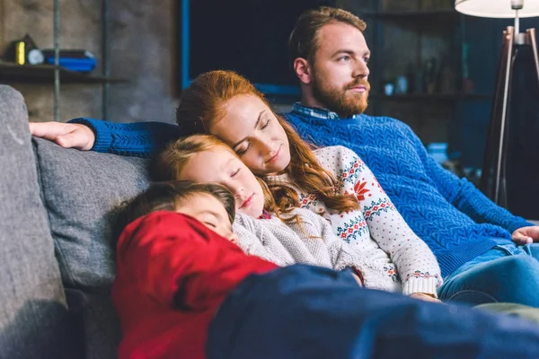 Family relaxing on sofa — Stock Photo