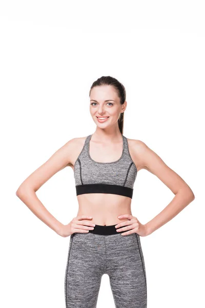 Happy sportswoman with hands on waist — Stock Photo