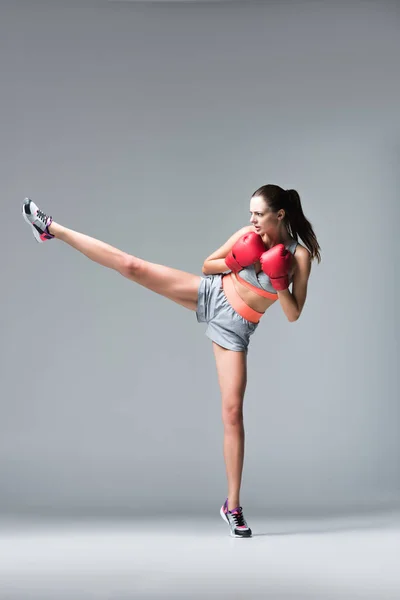 Sporty girl in boxing gloves — Stock Photo