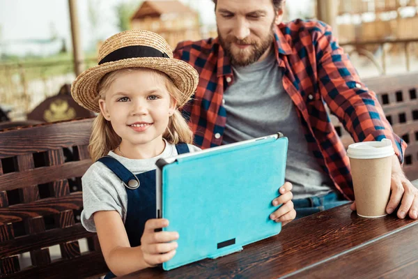 Kid holding tablet — Stock Photo