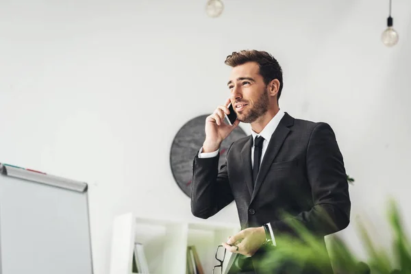 Businessman talking by phone — Stock Photo