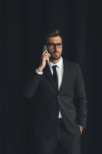 Businessman talking by phone — Stock Photo