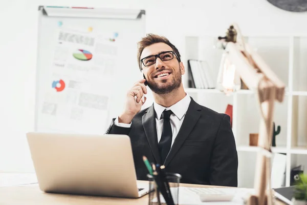 Businessman talking by phone — Stock Photo