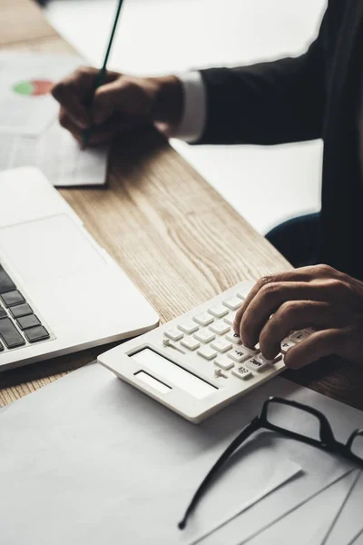 Accountant using calculator — Stock Photo