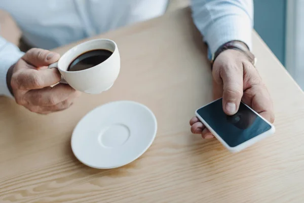 Businessman using smartphone — Stock Photo