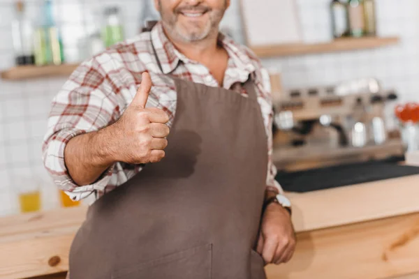 Bartender showing thumb up — Stock Photo