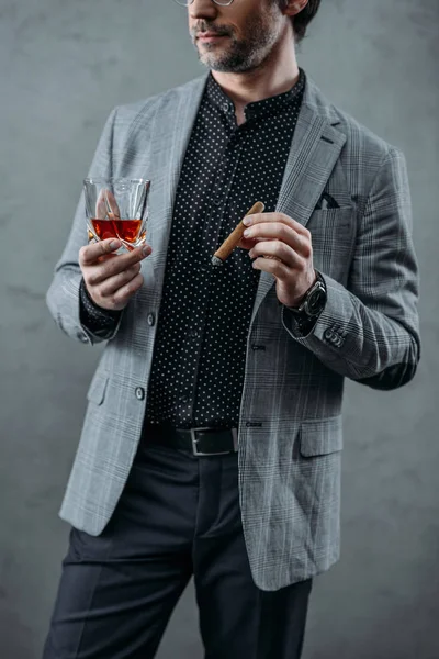 Businessman drinking whiskey — Stock Photo