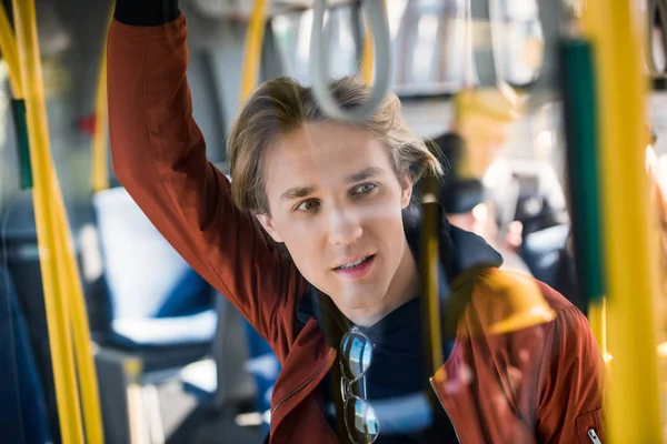 Young man in bus — Stock Photo